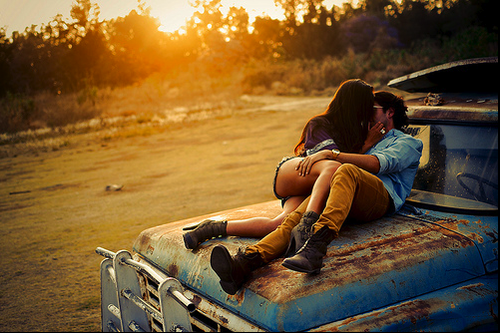 couple kissing on truck