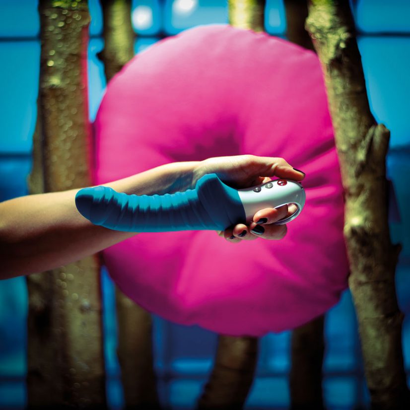 holding a large blue vibrator for better sex in 2023