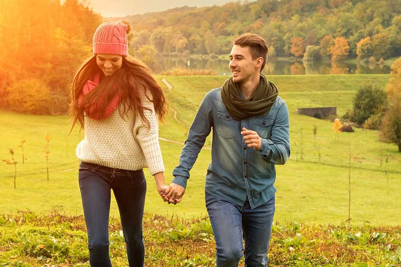 Young Couple Holding Hands Photo