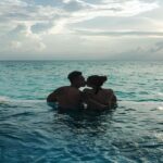 Couple Kissing In a Pool