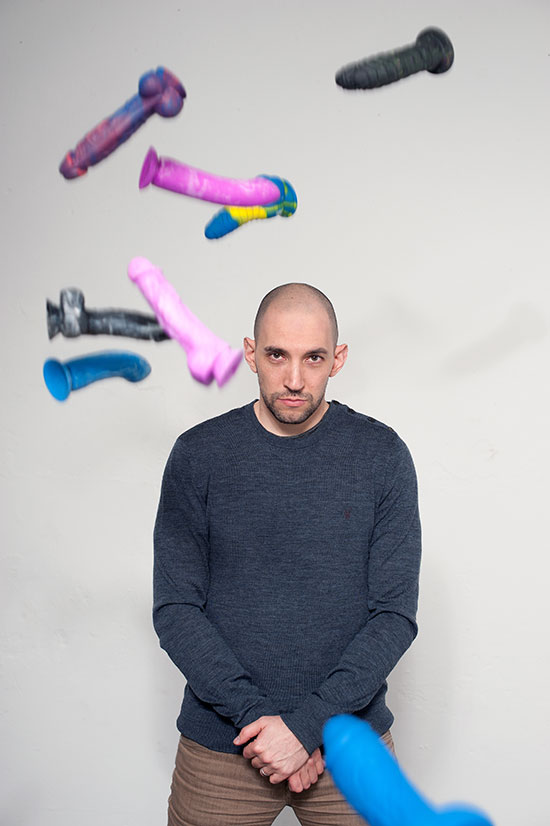 Brian Sloan with multicoloured dildos