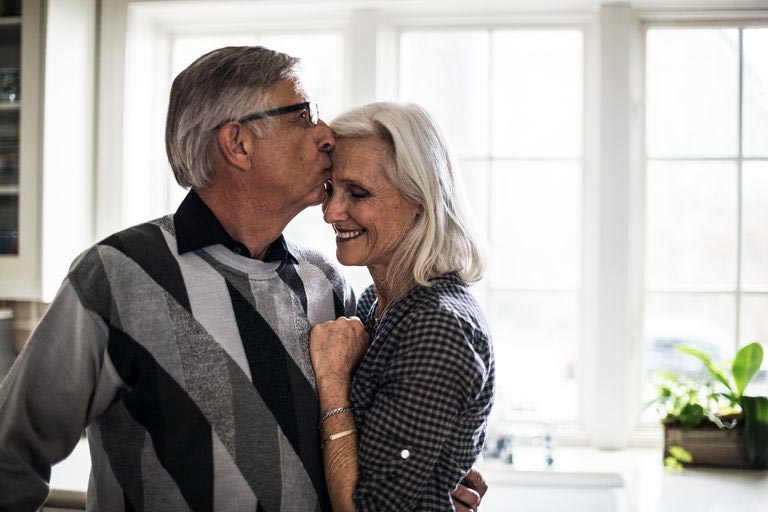 Old couple kissing