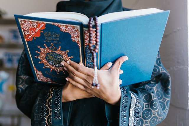 muslim holding quran