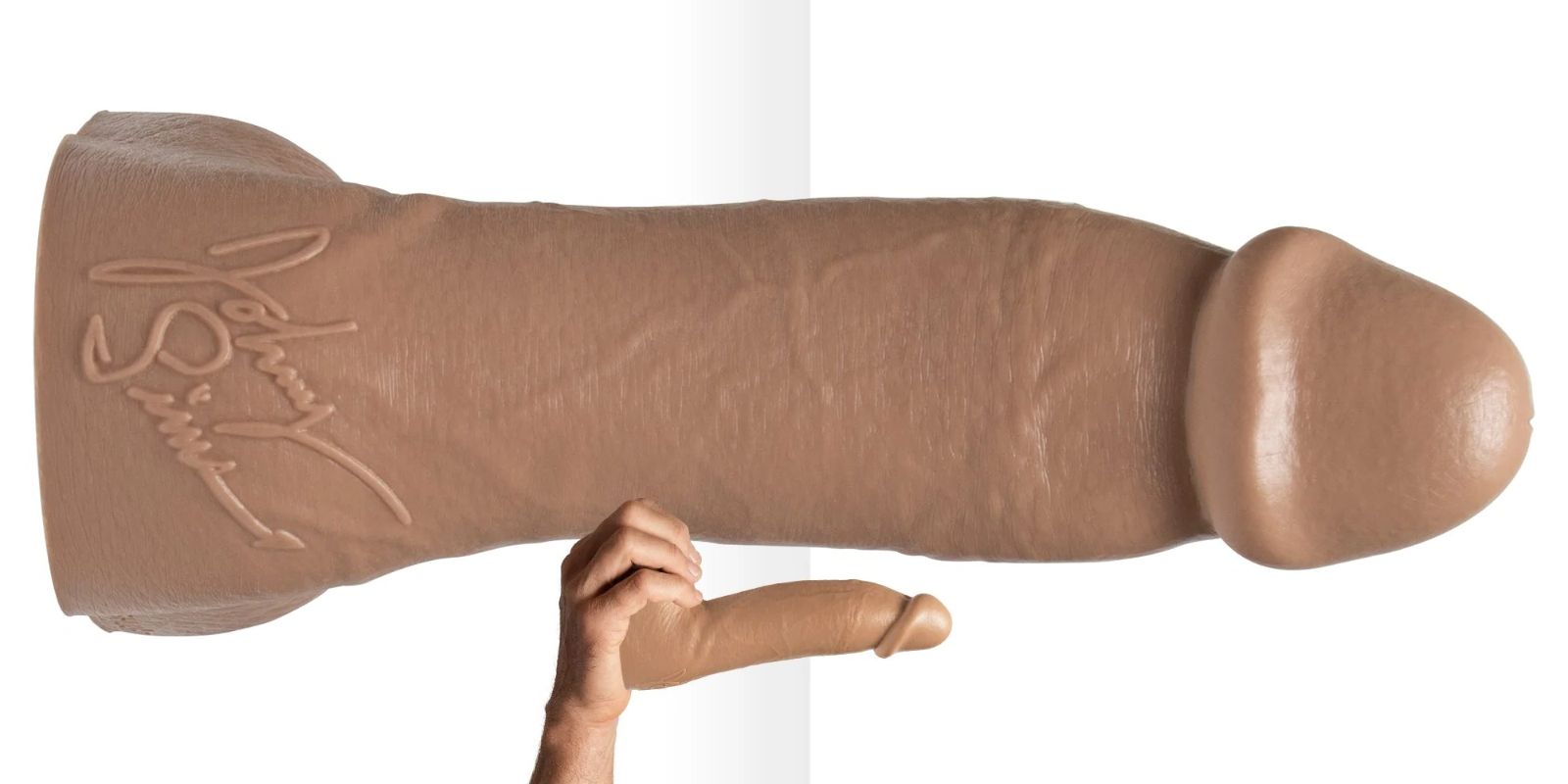 Realistic dildo molded from Johnny Sins, featuring detailed veins and firm shaft