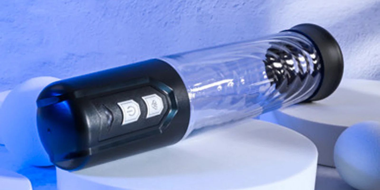 Sleek transparent vacuum penis pump with textured ABS plastic body and soft silicone entry ring, clear tube displaying measurement indicators