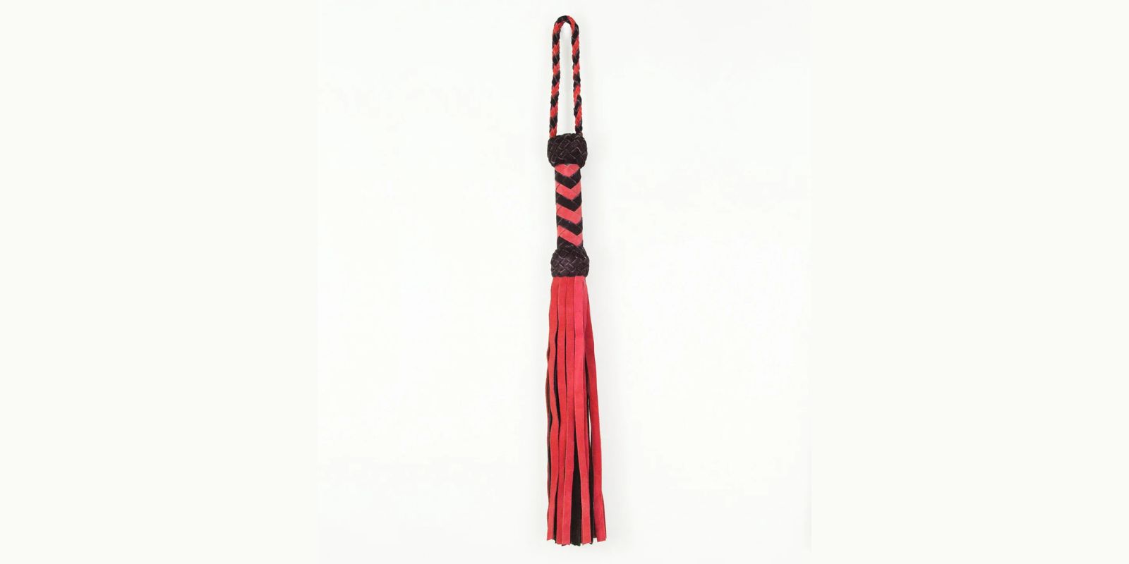 Long suede leather flogger with fringed tails and a knotted handle, available in multiple colour combinations.